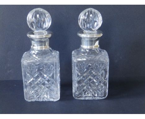 A cased pair of small modern square cut glass decanters with Mappin &amp; Webb silver collars - Birmingham hallmarks,  6.5" h