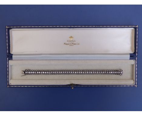 A diamond set 18ct white gold line bracelet, the 48 stones of total weight approximately 4 carats, 7", in Mappin &amp; Webb b