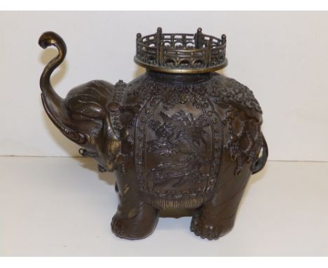 An Oriental bronze elephant incense burner, 9.5" high.