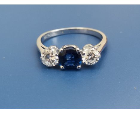 A three stone sapphire &amp; diamond claw set ring in 18ct white gold &amp; platinum.  Finger size O.