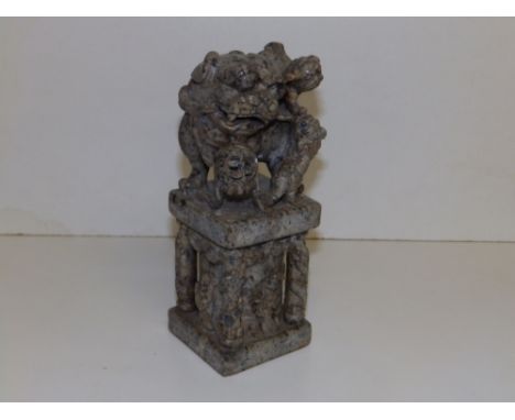 A large Chinese grey soapstone desk seal, the square base with corner columns flanking figures of Immortals, all surmounted b