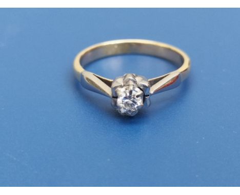 A small modern diamond solitaire ring, the stone of approximately 3mm diameter, on yellow metal shank.  Finger size K.