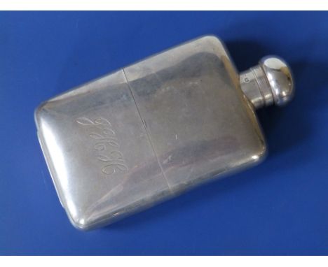 An all-silver hip flask of plain design by Mappin &amp; Webb, London 1920, 6.25" high.