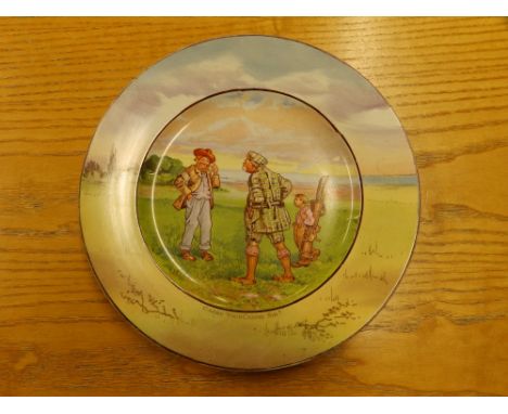 An early 20thC golfing plate decorated in colours -'Carry Your Caddy Sir?', 10" diameter.