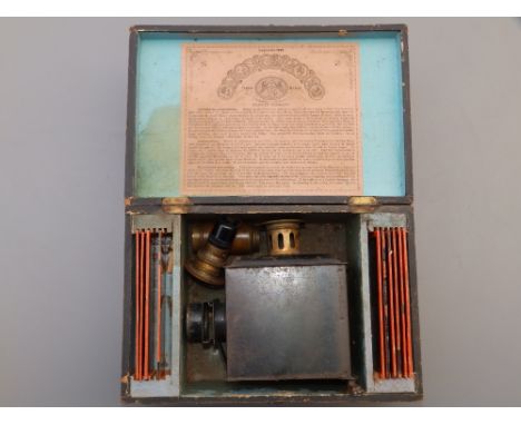 A small German 'Lanterna Magica' magic lantern in original box with 10 coloured glass slides for children - 'EP'. The box 10.