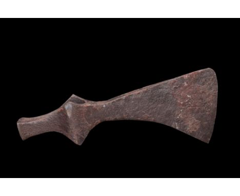 Ca. 900-1100 AD.An iron axe head boasts a sharp curved horizontal blade, carefully honed to achieve a keen cutting edge. The 