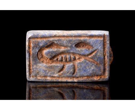Ca. 1550-1070 BC.A janiform Egyptian faience plaque amulet decorated on both sides. On one side there is an image of a goose 