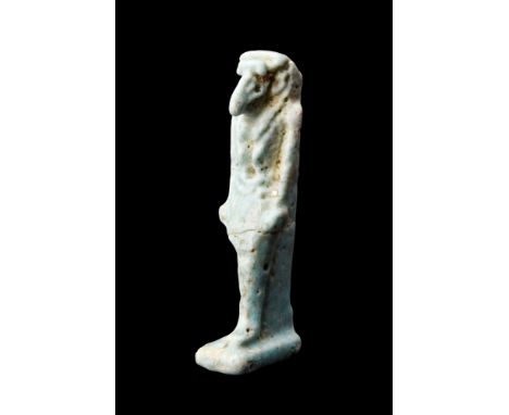 Ca. 664-332 BC.An Egyptian faience amulet of the god Thoth. He is depicted striding forward, with arms by his side and his fi