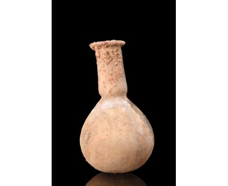 Ca. 100-200 AD.A glass unguentarium features a piriform lower body, which flares towards the base, and a tubular neck with a 