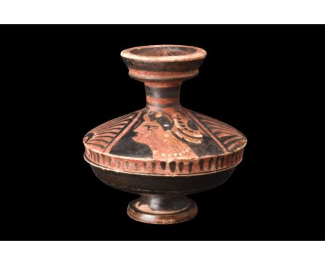 Ca. 340-325 BC.A ceramic lekanis of the red-figure lid with two female profile heads between palmettes and stylised volutes. 