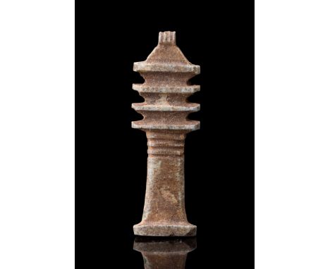 Ca. 664-332 BC.A pale turquoise faience amulet of the Djed pillar. The front is marked vertically between each crosspiece and