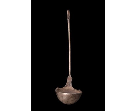Ca. 100-300 AD.A silver ladle with a deep, rounded bowl and a long, round-section handle with a loop finial. This piece is a 
