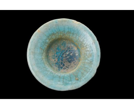 Ca. 1100-1200 AD.A shallow bowl with a stemmed foot and a flaring basin. The upper part of the body is adorned with a captiva