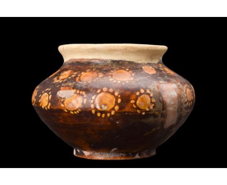Ca. 10th century AD.A pottery vessel of a distinctive form, characterized by a ring foot that provides stability and elevates