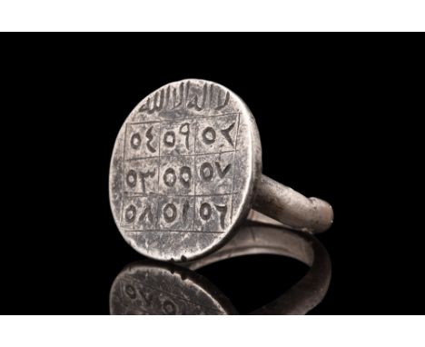 Ca. 16th -18th century AD .A ring crafted from silver consists of a round hoop that encircles the finger and a large circular