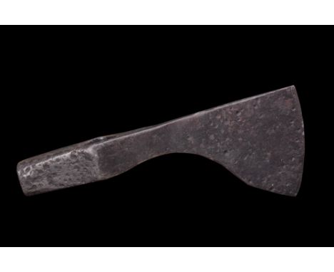 Ca. 900-1100 AD.An iron axe head with a sharp curved horizontal blade, a defining feature of this formidable weapon. The pron
