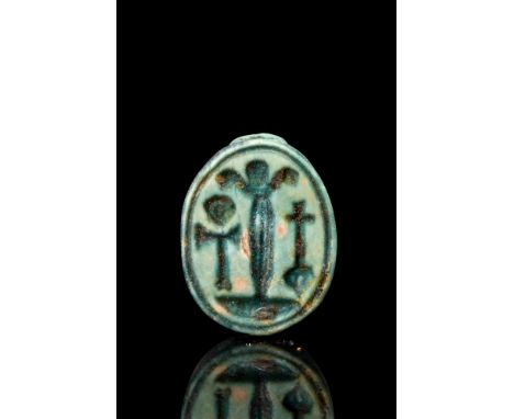 Ca. 1550-1070 BC.A beautiful green glazed steatite scarab amulet with stylised incised features such as clypeus, prothorax an