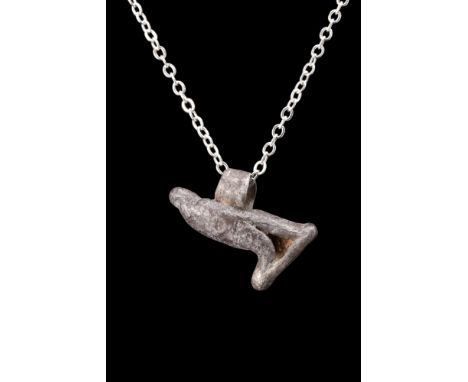 Egypt, ca. 30 BC-300 AD.A silver eagle amulet, crafted with exceptional artistry, depicts an eagle with its majestic wings fo