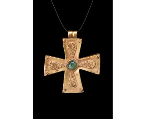 Ca. 1000-1500 AD.A gold cruciform pendant, meticulously crafted with exquisite attention to detail. Composed of a cross with 