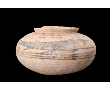 Ca. 3000-2500 BC.A terracotta vessel adorned with a fish motif. It features a squat body with a flattened base and a raised r