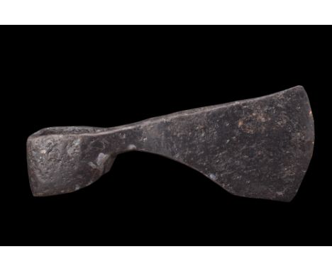 Ca. 900-1100 AD.An iron axe head features a horizontal blade with a graceful curvature that allows for efficient cutting and 