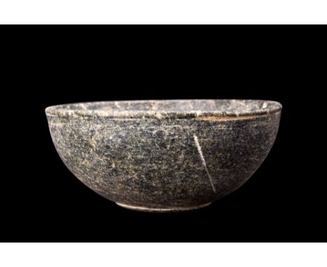 Ca. 3rd millennium BC.A stone bowl with hemispherical body, flat base, and a deep basin. The walls of the bowl are meticulous