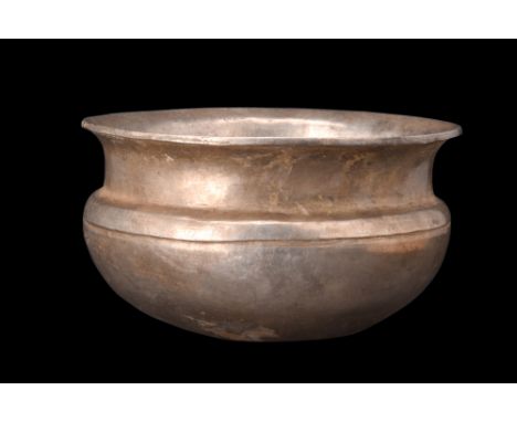 Ca. 4th-3rd century BC.A libation bowl, meticulously crafted from silver is characterized by distinct features that contribut