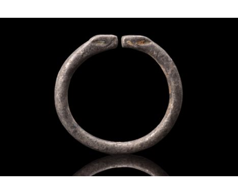 Ca. 100 BC.A silver ring featuring a round hoop with a round-section shank, designed in a penannular form that allows for eas
