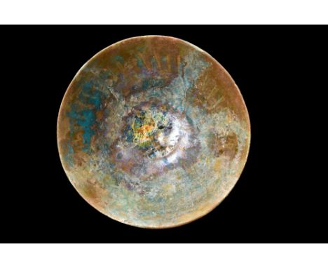 Ca. 1100-1200 AD.A pottery bowl with flaring form, resting on an elevated foot, creates an elegant and harmonious composition
