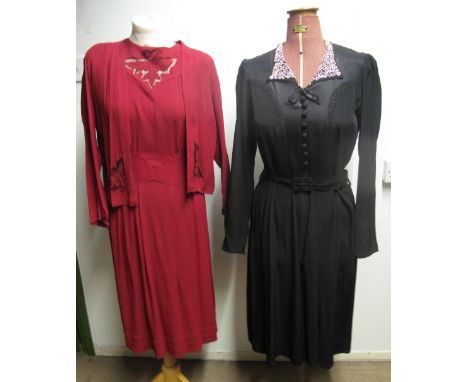 Three vintage 1940's dresses to include: a dark red crepe dress with short sleeves and flower detail on chest and a matching 