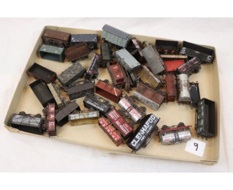 Collection of 35 OO gauge items of rolling stock wagons and trucks to include Mainline, Airfix, Dapol, and Bachmann