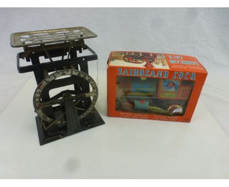Boxed Japanese Daiya Battery Operated Mystery Action Fairyland Loco plus a set of vintage tin plate toy scales (2)