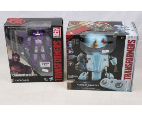 Two boxed Hasbro Transformer figures to include Generations Combiner Wars Cyclonus and The Last Knight Autobot Sqweeks RC (ro