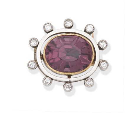 SPINEL AND DIAMOND BROOCH, EARLY 20TH CENTURYThe oval-cut pink spinel within a cushion-shaped diamond surround,  length 1.9cm
