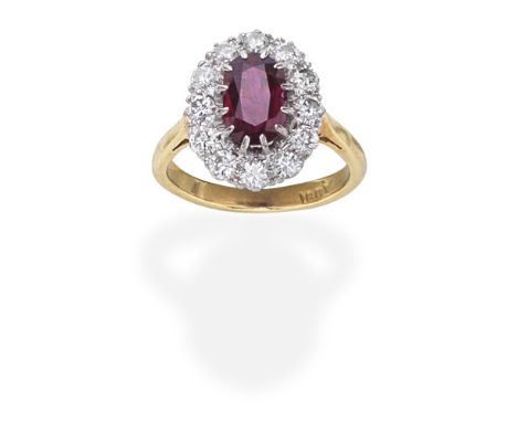 RUBY AND DIAMOND CLUSTER RINGThe oval-cut ruby within a brilliant-cut diamond surround, diamonds approx. 0.50ct total,  ring 