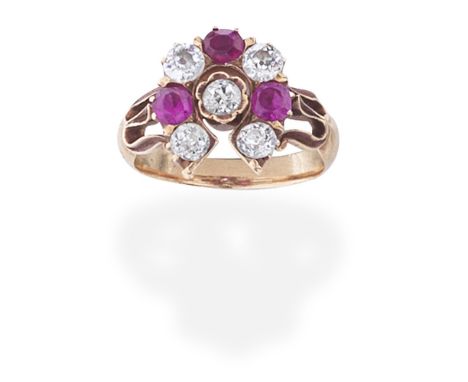 RUBY AND DIAMOND HORSE-SHOE RING, CIRCA 1890The central old brilliant-cut diamond within a similarly-cut diamond and circular