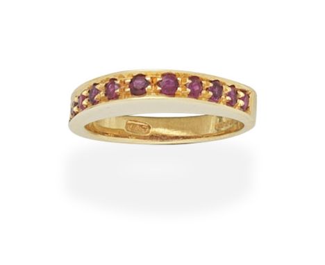 JOHN DONALD: RUBY-SET RING, 1976The mount of arched design, set with circular-cut rubies,  maker's mark JAD, London import ma