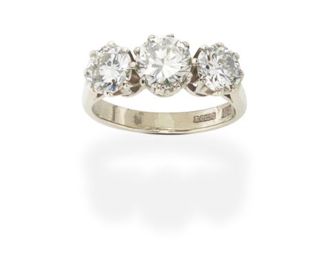 DIAMOND THREE-STONE RING,  1994Set with brilliant-cut diamonds, the central diamond weighing 1.14cts, mounted in 18 carat whi
