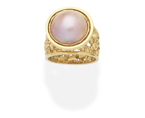 JOHN DONALD: CULTURED MABÉ PEARL RING, 2003The cultured mabé pearl of pink tint within an 18 carat gold abstract textured mou