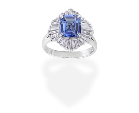 SAPPHIRE AND DIAMOND BALLERINA RINGThe step-cut sapphire set within an undulating surround of tapered baguette-cut diamonds, 