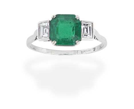 EMERALD AND DIAMOND THREE-STONE RINGThe octagonal-cut emerald between baguette-cut diamonds,  diamonds approx. 0.45ct total, 