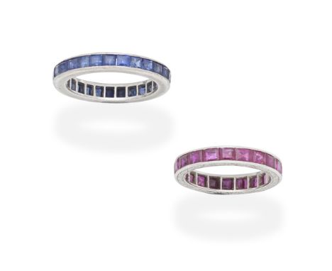 TWO GEM-SET ETERNITY RINGS1st: Set throughout with step-cut rubies, 2nd: Set throughout with step-cut sapphires, ring sizes a
