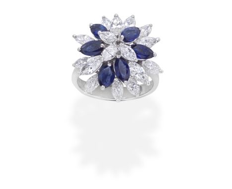 SAPPHIRE AND DIAMOND CLUSTER  RING,  1977Of tiered design, set with marquise-cut diamonds and sapphires,  diamonds approx. 3.