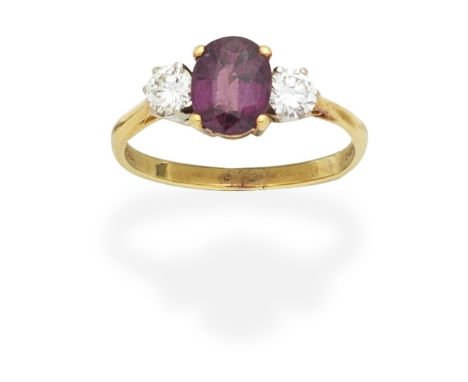 RUBY AND DIAMOND THREE-STONE RING, 1985The oval-cut ruby set between brilliant-cut diamonds, mounted in 18 carat gold, diamon