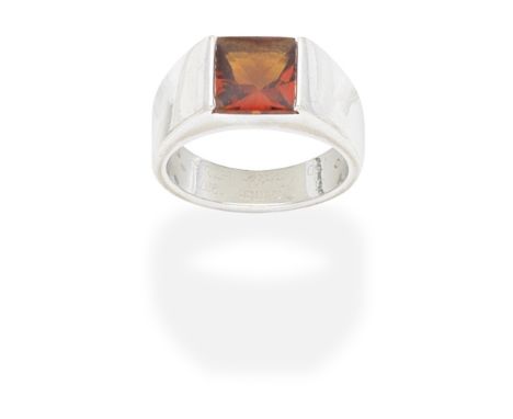 CARTIER: CITRINE 'TANK' RINGSet with a bufftop citrine, mounted in 18 carat white gold, signed Cartier, numbered, Swiss assay