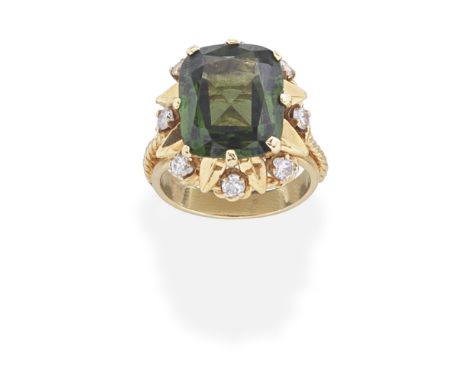 GREEN ZIRCON AND DIAMOND CLUSTER RINGThe cushion-shaped green zircon within a surround of leaf and ropetwist design, set with