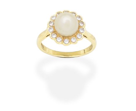 CULTURED PEARL AND DIAMOND RING, 1982The 7.5mm cultured pearl within a brilliant-cut diamond surround, mounted in 18 carat wh