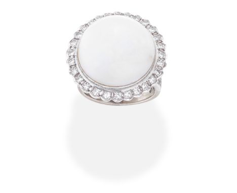 CULTURED MABÉ PEARL AND DIAMOND DRESS RINGThe 17.0mm cultured mabé pearl, within a single-cut diamond surround,  ring size ap