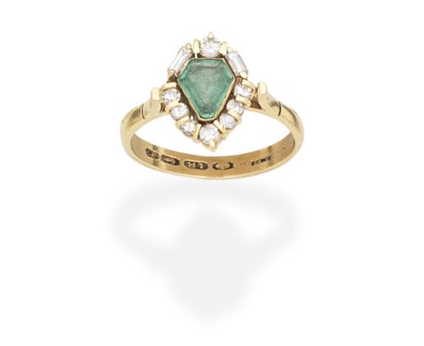 EMERALD AND DIAMOND CLUSTER RINGThe shield-shaped emerald within a brilliant, single, and baguette-cut diamond surround, moun