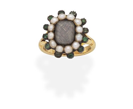SEED PEARL AND EMERALD HAIRWORK MOURNING RING, EARLY 19TH CENTURYThe central glazed compartment containing braided hairwork, 